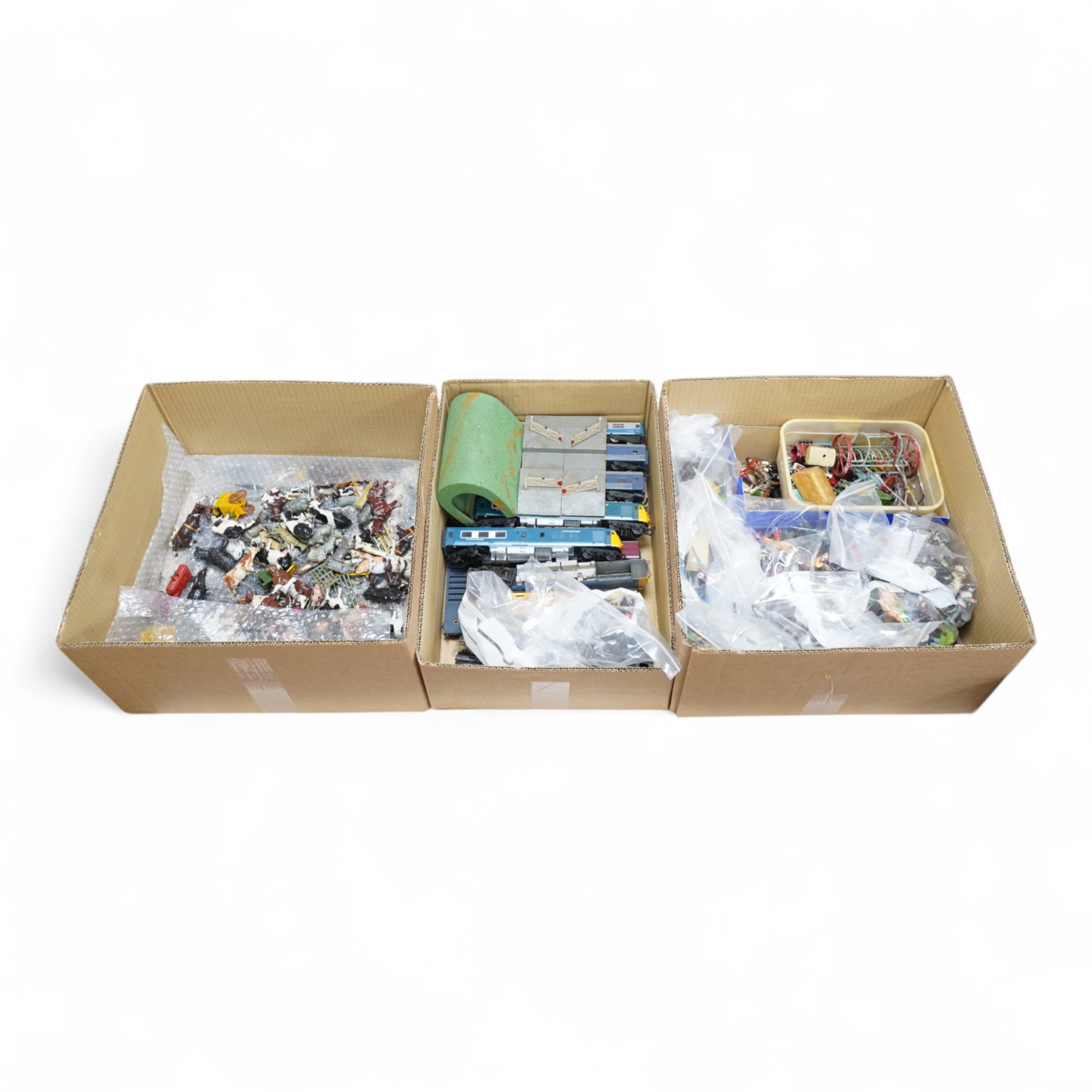 A quantity of diecast toys, plastic and lead soldiers, and 00 gauge model railway, including; a good quantity of Britains, etc. lead animals, Britains Deetail plastic soldiers, etc. Britains lead soldiers, farm equipment